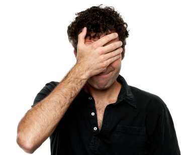Man_Covering_Face_with_Hand